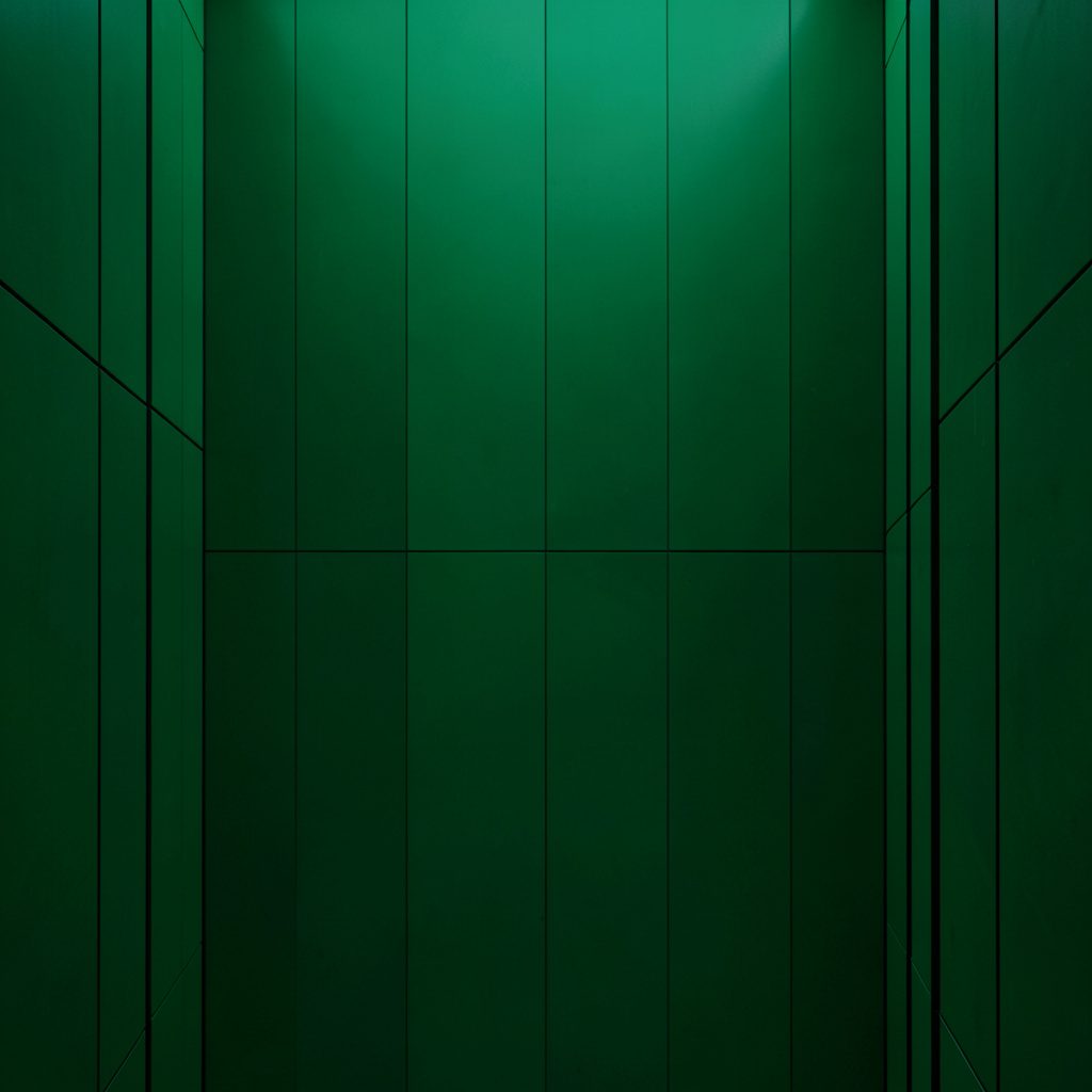 Clean architectural photograph with strong symmetry, warm neutral tones, and soft diffused lighting